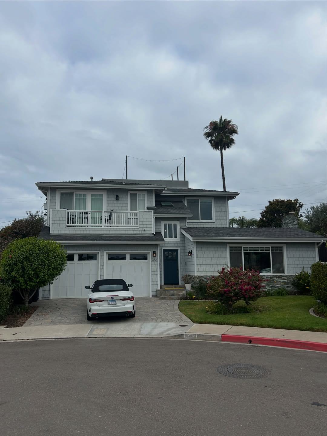 Two-story home exterior repaint before